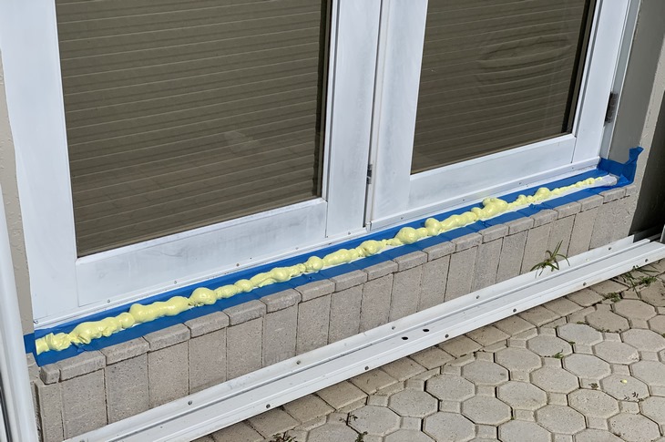 French door leakind at the sill threshold into the wood flooring